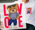 Love boy Bear DTF Transfer ready to press | cute teddy bear with the word love in big red letters | LuxuryDTF.com 