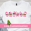 White t-shirt with 'George' design featuring Santa hats and a Christmas tree, with jeans in the background.