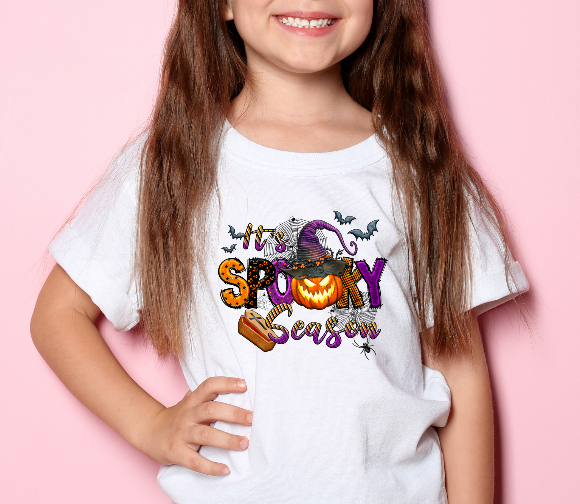 Girl child wearing white shirt with colorful 'Spooky Season' DTF design - LuxuryDTF.com