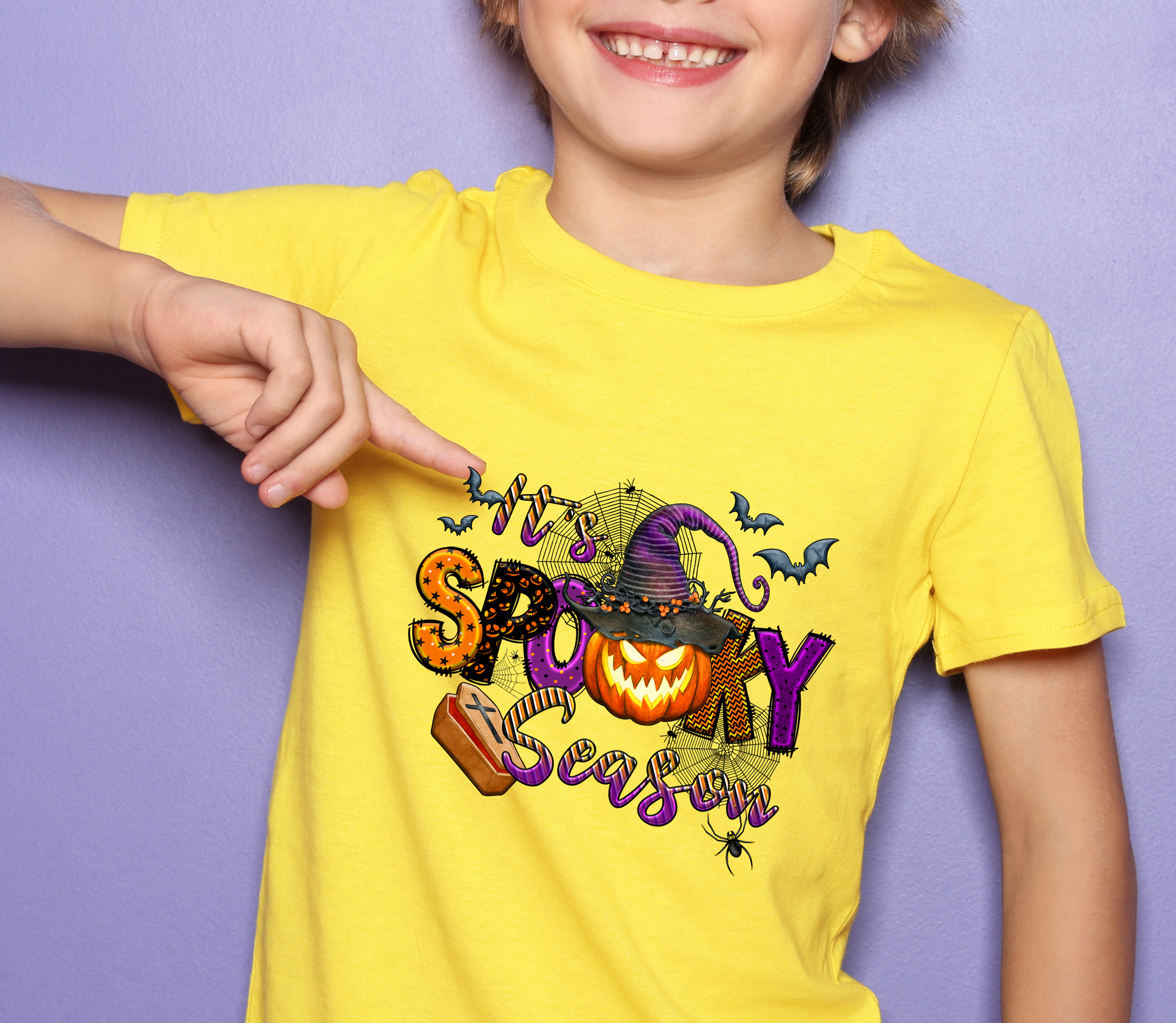 Boy child in yellow shirt with 'It's a Spooky Season' Halloween DTF design - LuxuryDTF.com