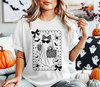 Woman wearing a white t-shirt featuring a boho leopard print ghost DTF transfer design with sunglasses, a bow, and a purse.