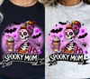Spooky mom dtf transfer, spooky mom halloween dtf transfers, mom halloween transfers, skeleton halloween dtf transfers on a black and white t-shirts