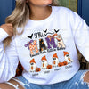 Custom ghost family dtf transfer, White sweatshirt with Halloween-themed design featuring ghosts and text, worn by a person. Personalized custom halloween design for t-shirts. This mama loves her little boos.