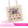 Personalized halloween dtf transfer applied to tote bag with Halloween-themed design and text on a white background 
