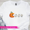 White t-shirt with Halloween-themed design featuring a pumpkin and ghosts on a wooden surface.