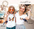 Beautiful Butterfly Logo in DTF Transfers printed on a white t-shirt of two girls