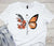 Beautiful Butterfly Logo in DTF Transfers printed on a white t-shirt